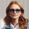 La modella indossa The LEMTOSH In Black in misura 49 con Broadway Blue Fade Colorato Lenses Moscot LEMTOSH BLACK Custom Made Tints CABERNET